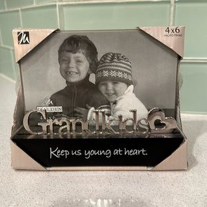 Brand-new picture frame with silver lettering that says “Grandkids”